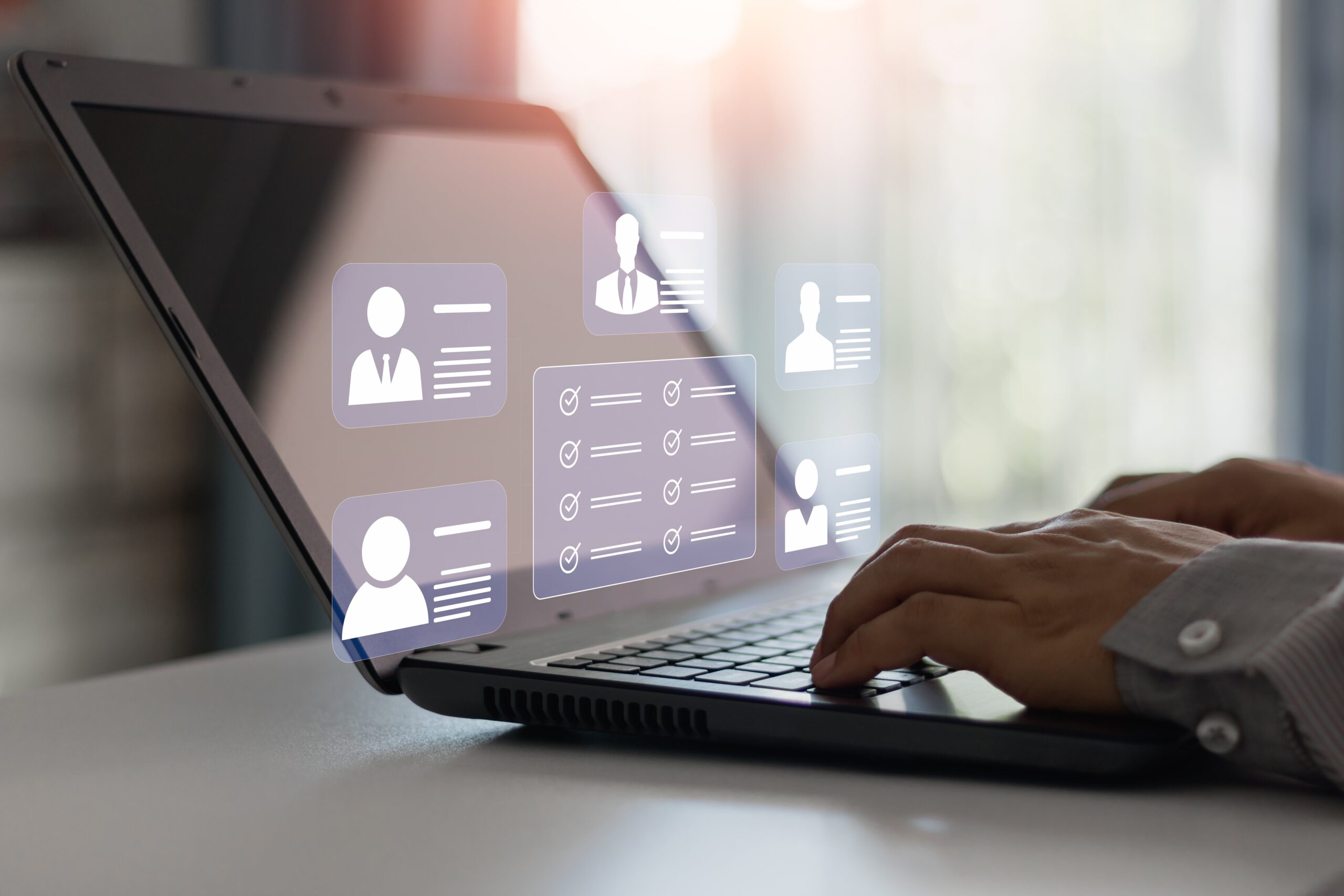 Person using laptop symbolizing digital workspace and employee survey tools.